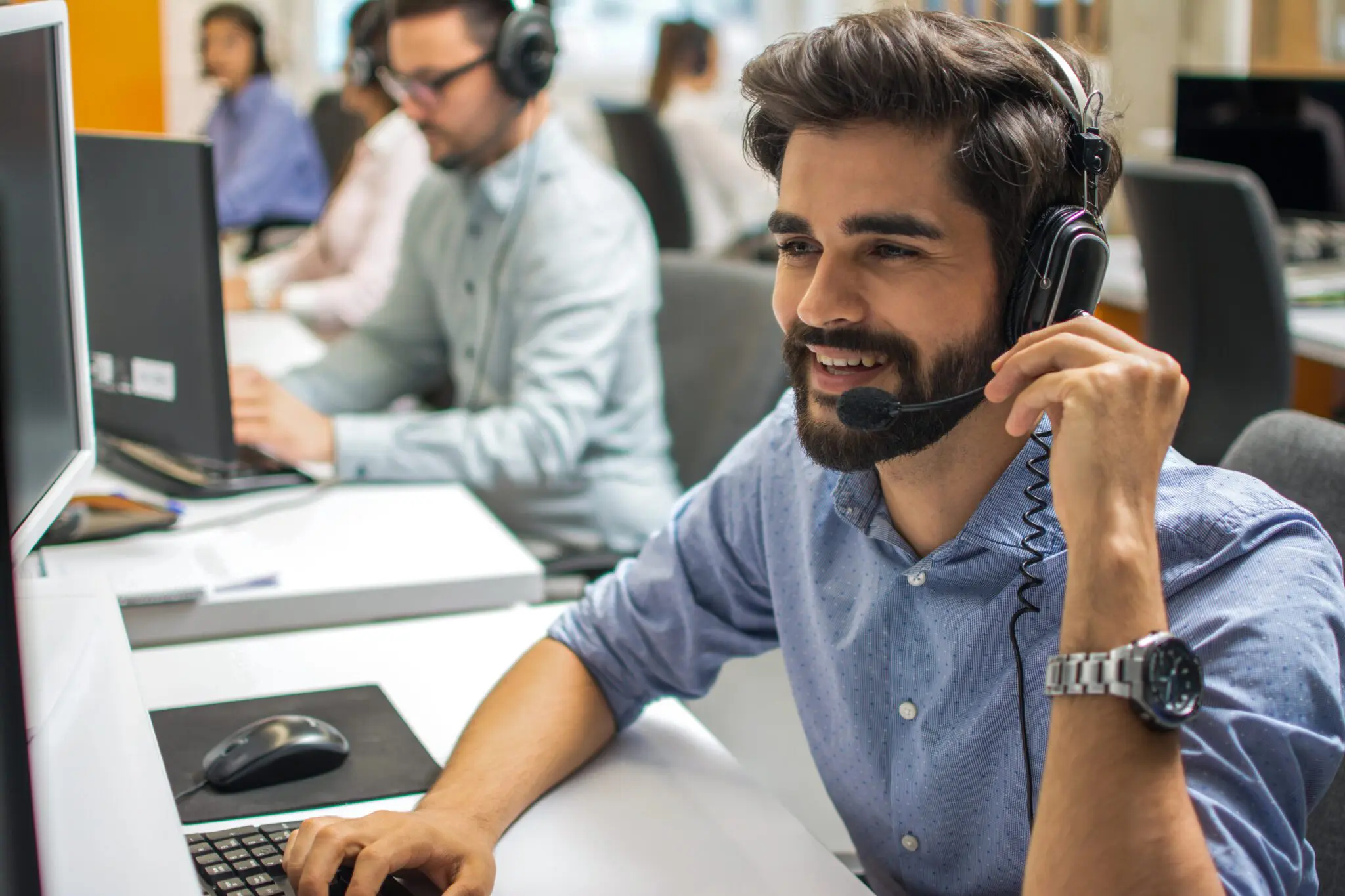Portrait of happy smiling customer support phone operator in hea